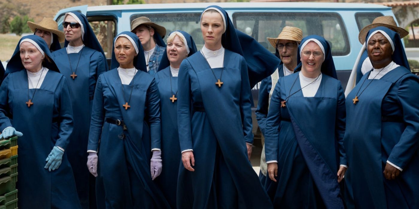 Sister Simone (Betty Gilpin) standing in front of a group of other nuns in Mrs. Davis