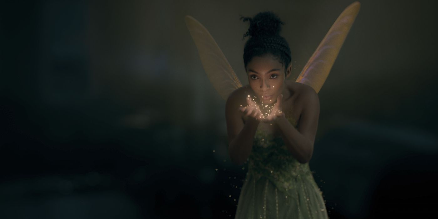 Yara Shahidi as Tinker Bell blowing pixie dust in Peter Pan & Wendy