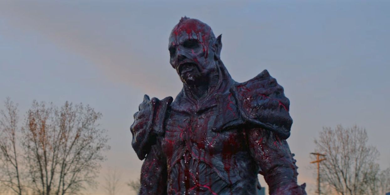 Psycho Goreman covered in blood after a battle in PG: Psycho Goreman (2020)