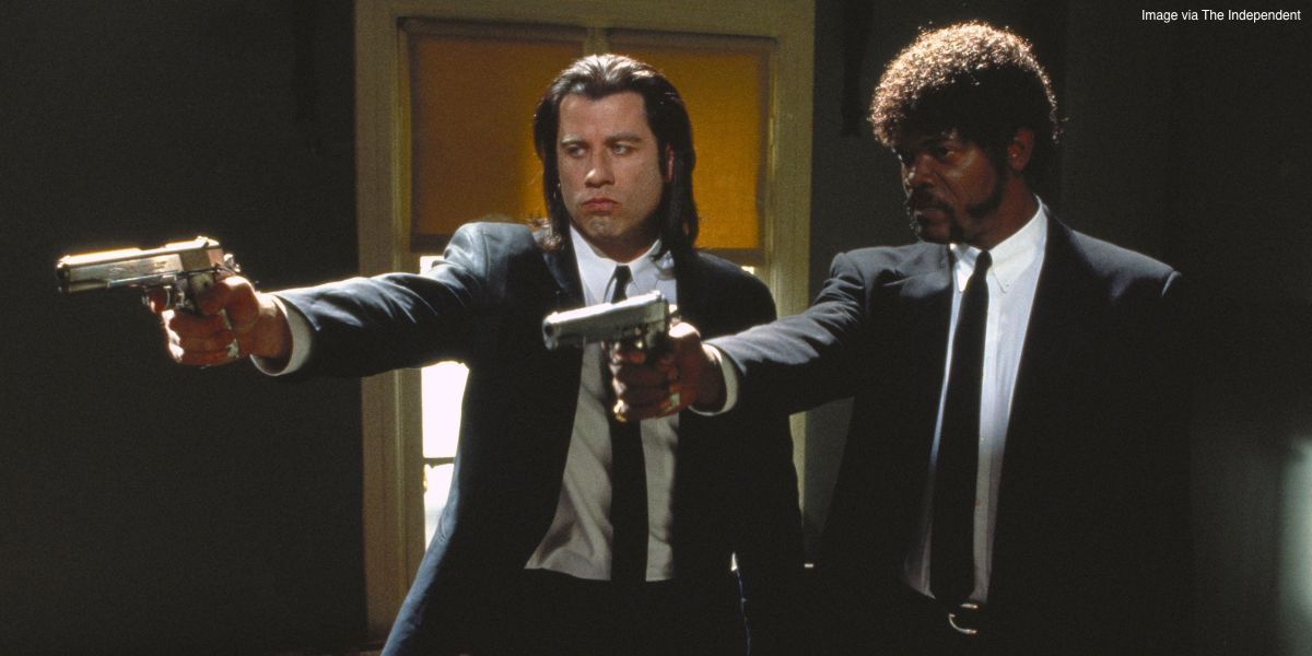 John Travolta and Samuel L. Jackson as Vincent Vega and Jules Winnfield aiming their guns in the same direction in Pulp Fiction