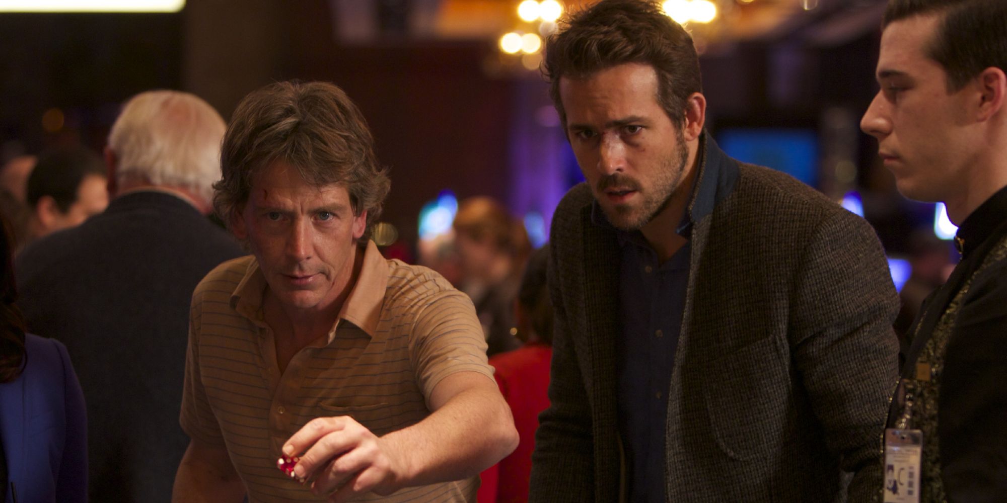 Ryan Reynolds and Ben Mendelsohn playing a game at the casino in Mississipi Grind