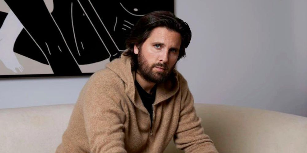 Scott Disick sitting on a couch