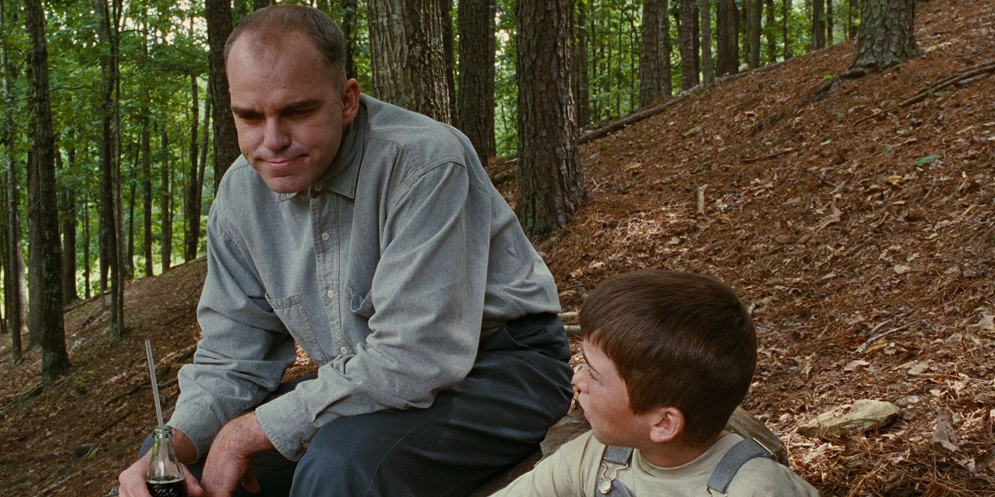 A man talking to a boy in the woods in Sling Blade