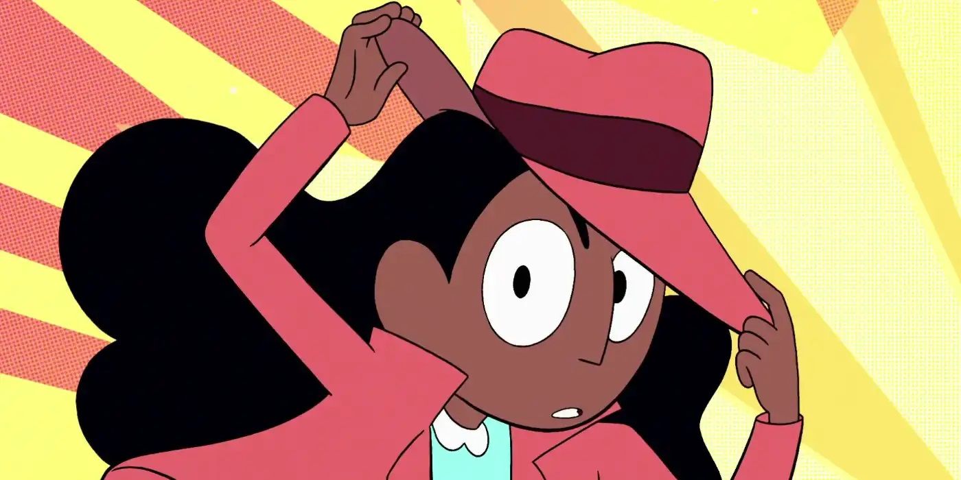 Connie wearing a fedora and jacket