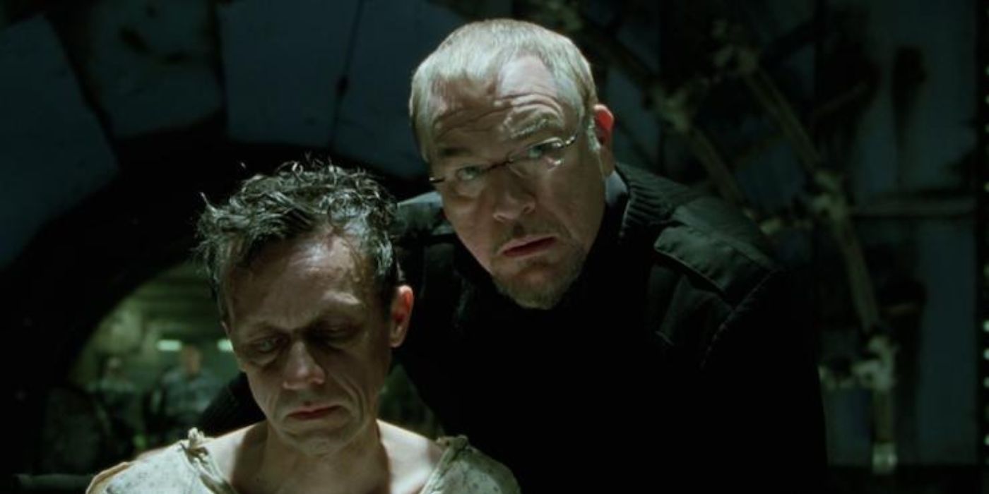 Brian Cox's William Stryker leaning over his son Jason, played by Michael Reid MacKay, in X2: X-Men United