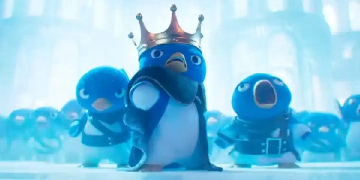 A still from The Super Mario Bros Movie featuring the Penguin King, played by Khary Payton, surrounded by his penguin soldiers getting ready to charge into battle.