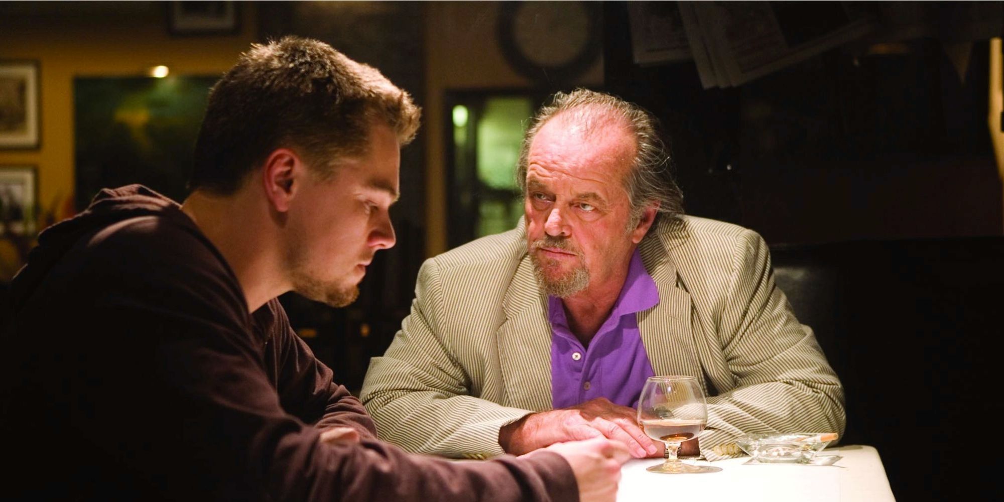 Leonardo DiCaprio as Billy Costigan and Jack Nicholson as Jack Costello having a conversation in The Departed