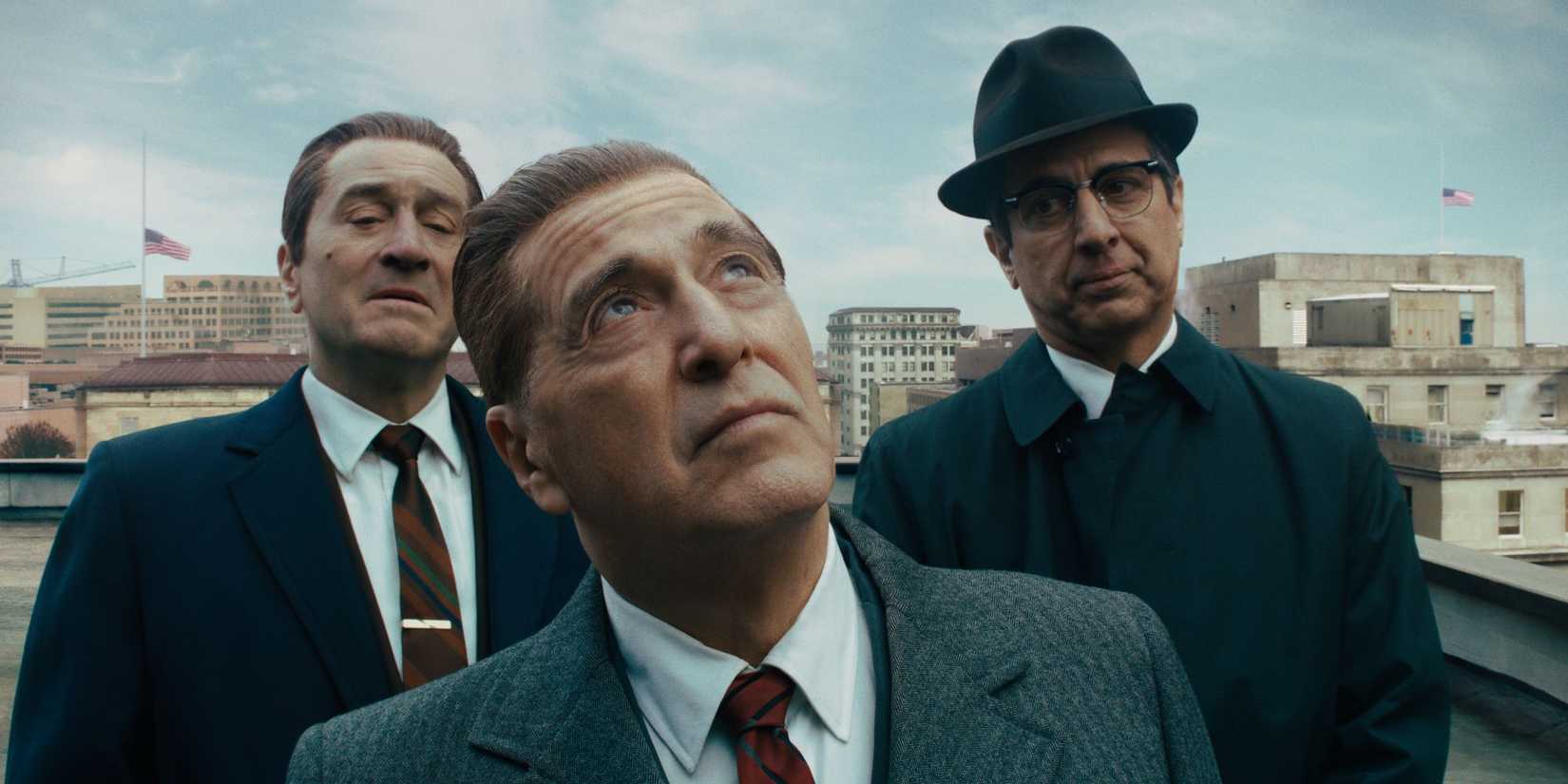 Robert De Niro, Al Pacino, and Ray Romano looking in the same direction in The Irishman