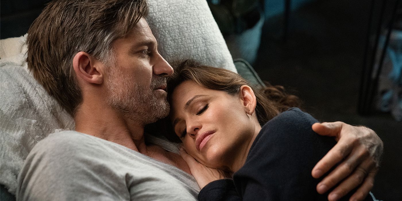 Nikolaj Coster-Waldau and Jennifer Garner cuddle in a scene from The Last Thing He Told Me