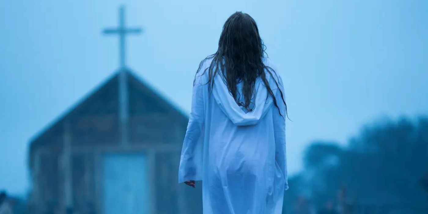 A scene from The Leftovers where a woman walks toward a church 