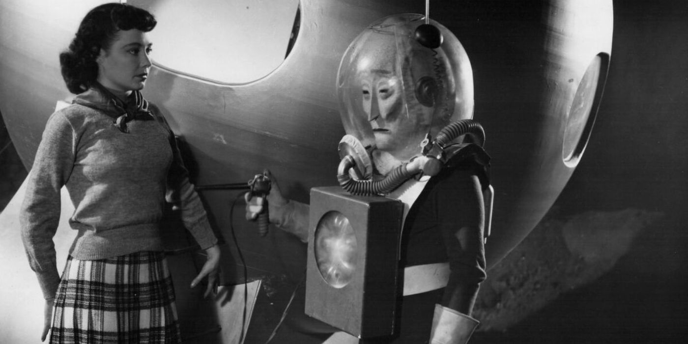 An alien talking to a woman in The Man from Planet X