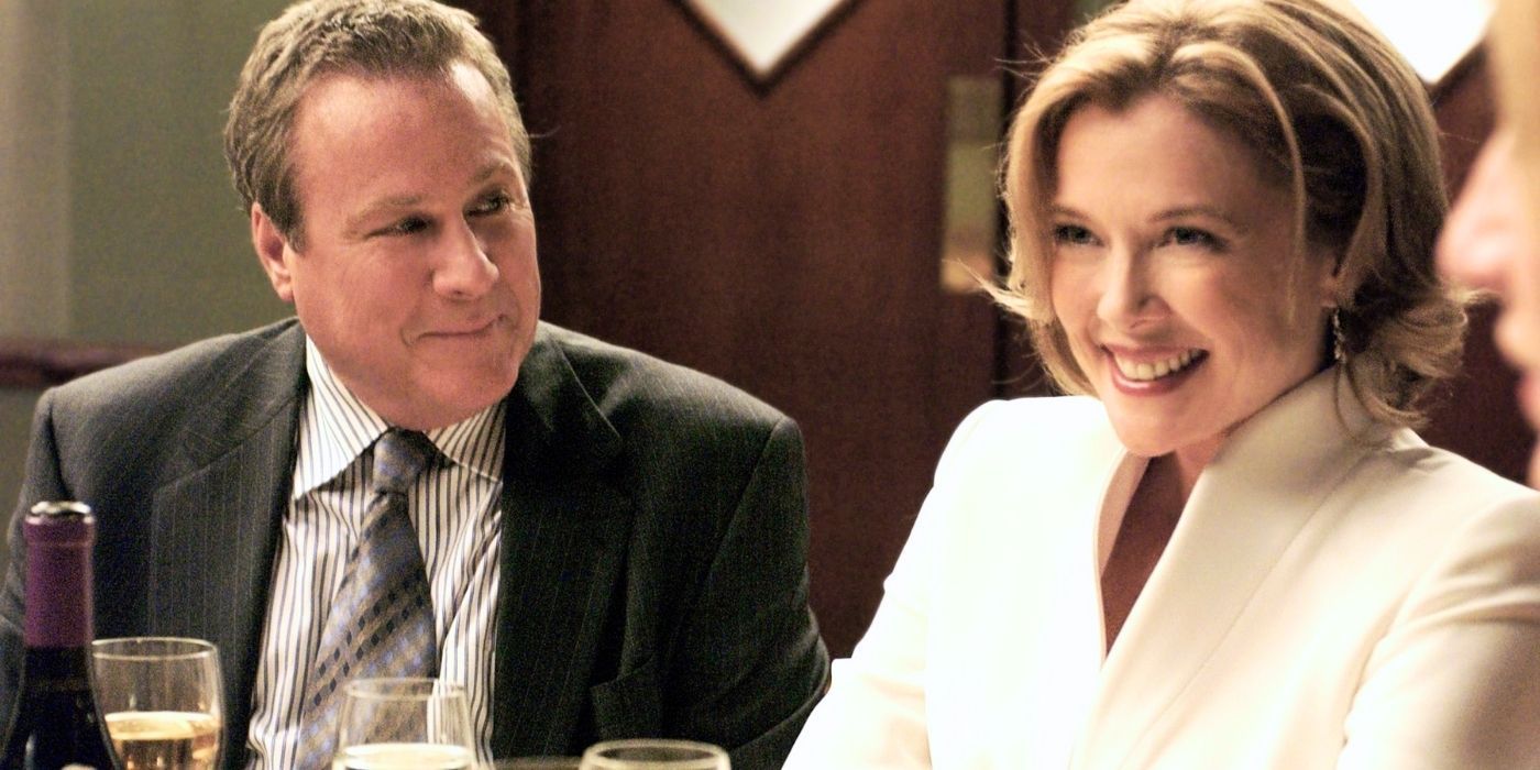 John Heard looking at Annette Bening sitting next to him at a dinner table in The Sopranos