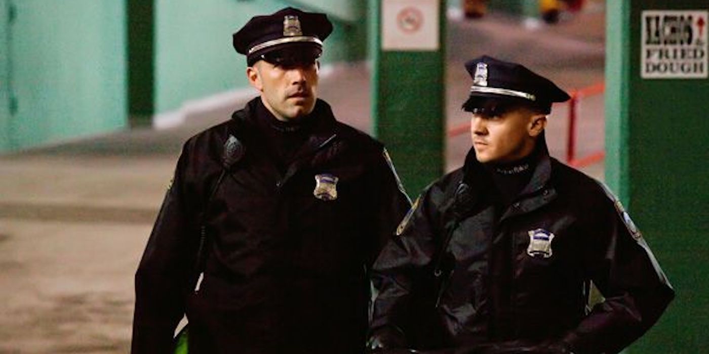 Ben Affleck and Jeremy Renner dressed as police in The Town