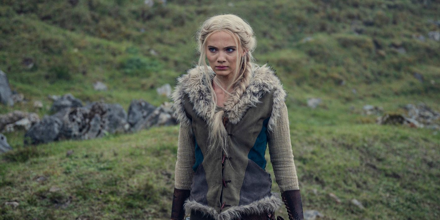 Freya Allan as Ciri standing in an open field in The Witcher Season 3