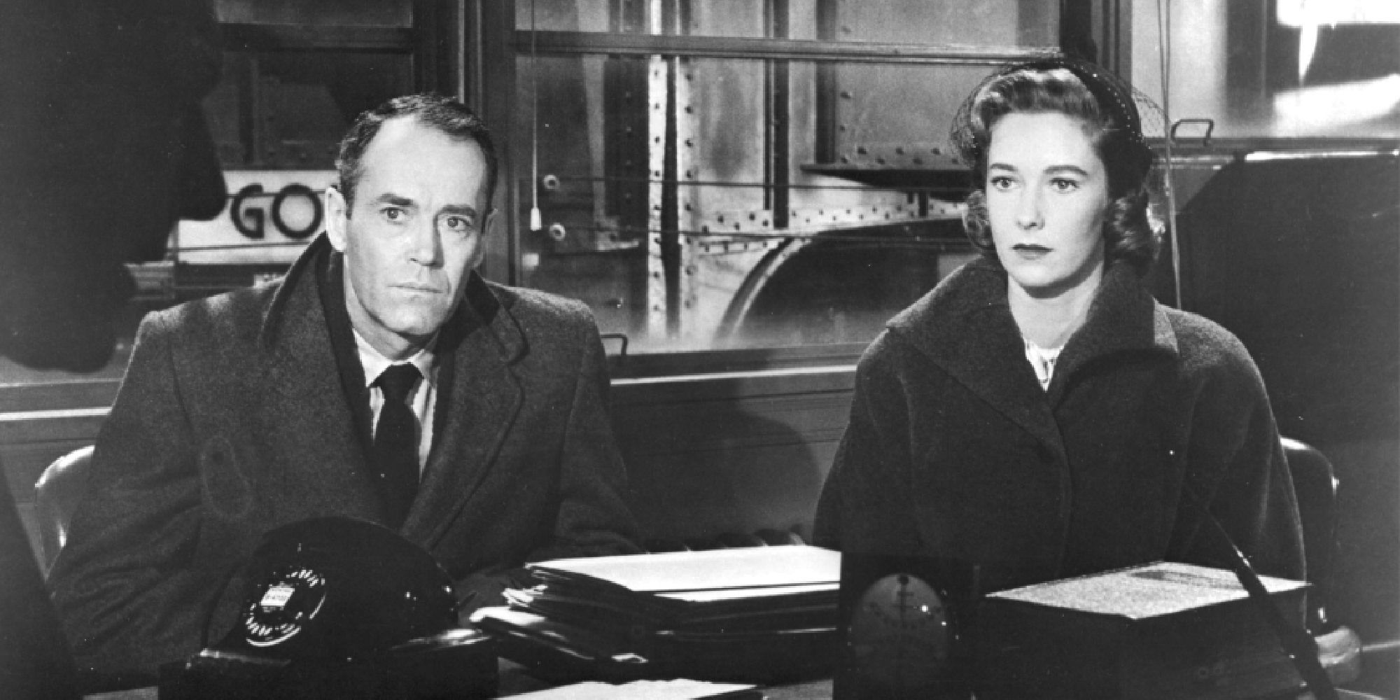 Henry Fonda and Vera Miles as Manny and Rose, looking intently in the same direction in The Wrong Man