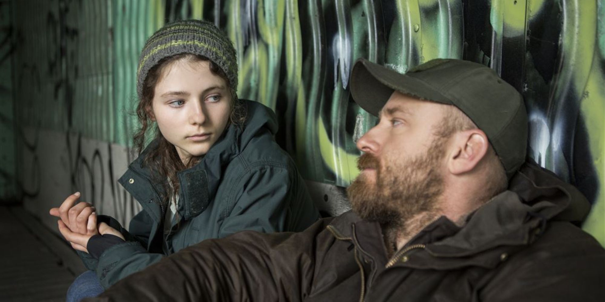 Thomasin McKenzie and Ben Foster stare at each other in Leave No Trace