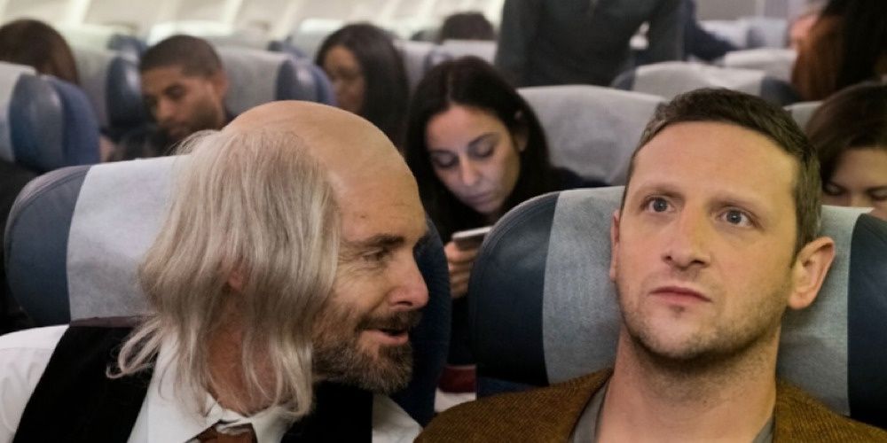 Tim Robinson sitting next to a creepy passenger on a flight. 