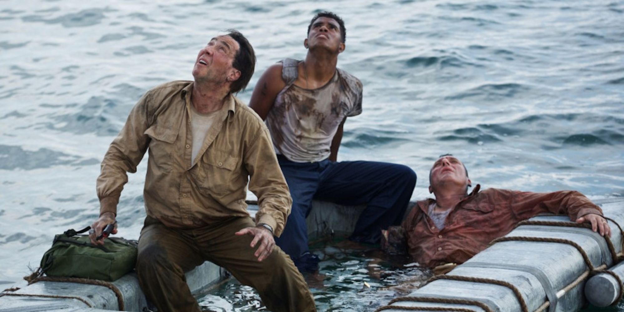 Captain Charles McVay (Nicolas Cage) and two men on a lifeboat in USS Indianapolis (2016)