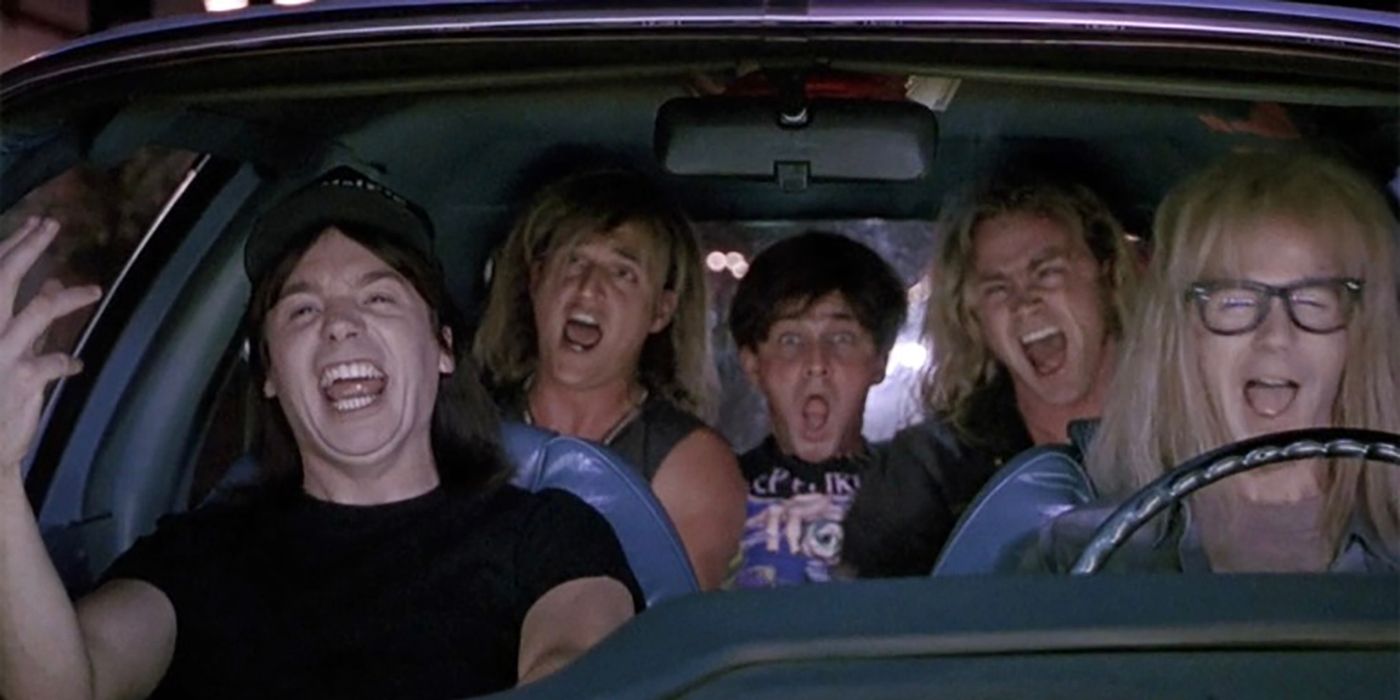 Wayne and Garth in the car rocking in Wayne's world, three friends in the back seat singing along.