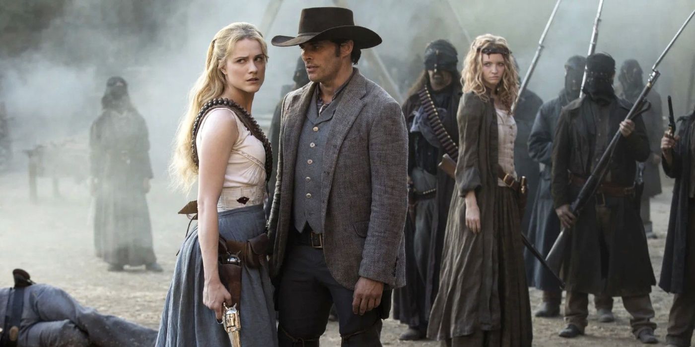 Dolores, played by Evan Rachel Wood, and Teddy, played by James Marsden, standing among a crowd in Westworld.