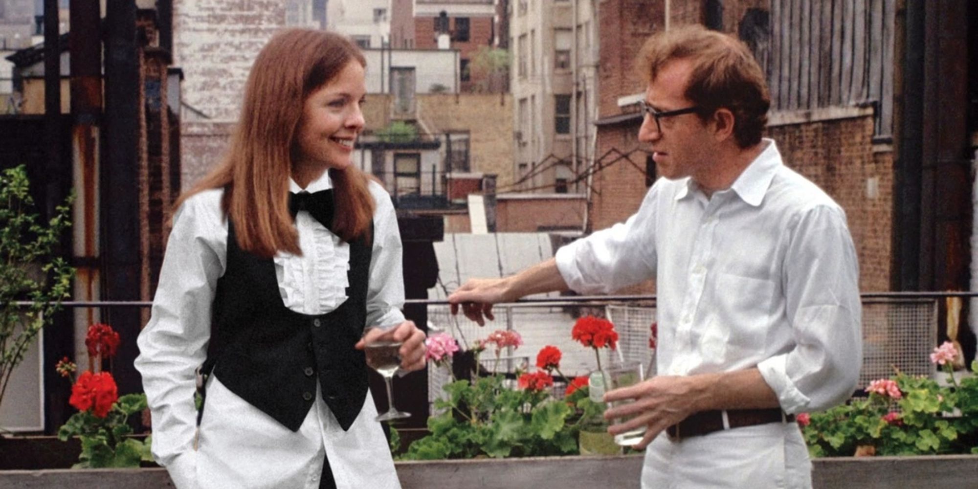 Annie Hall and Alvy talking while holding drinks in Annie Hall