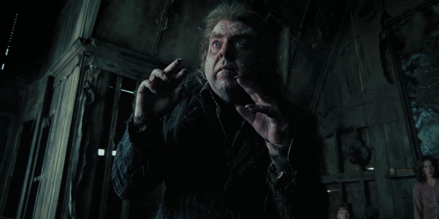 Peter Pettigrew (Timothy Spall) with his hands up and looking concerned in Harry Potter and the Prisoner of Azkaban