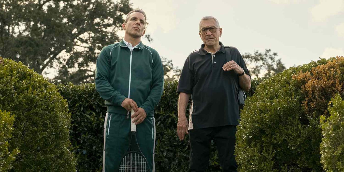 Sebastian Maniscalco and Robert De Niro stand near bushes in About My Father.