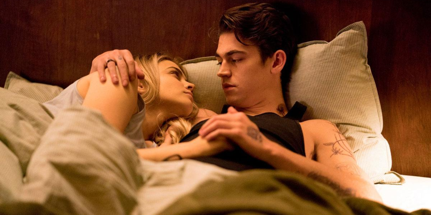 Tess played by Josephine Langford and Hardin played by Hero Fiennes Tiffin both lying in bed together in After Everything