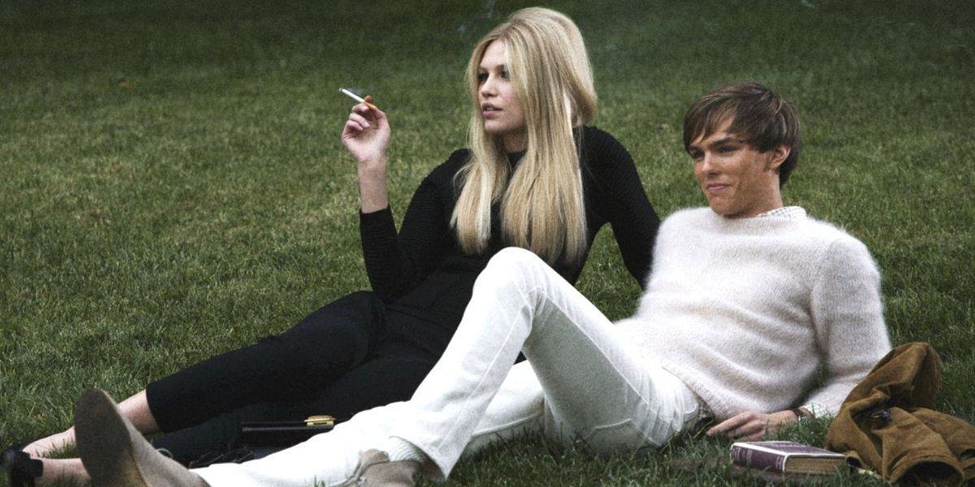 Aline Weber and Nicholas Hoult lying on the grass in 'A Single Man'