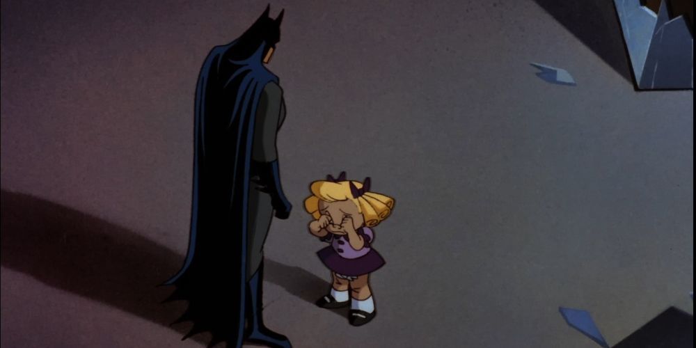 Batman stands with a grieving Baby Doll