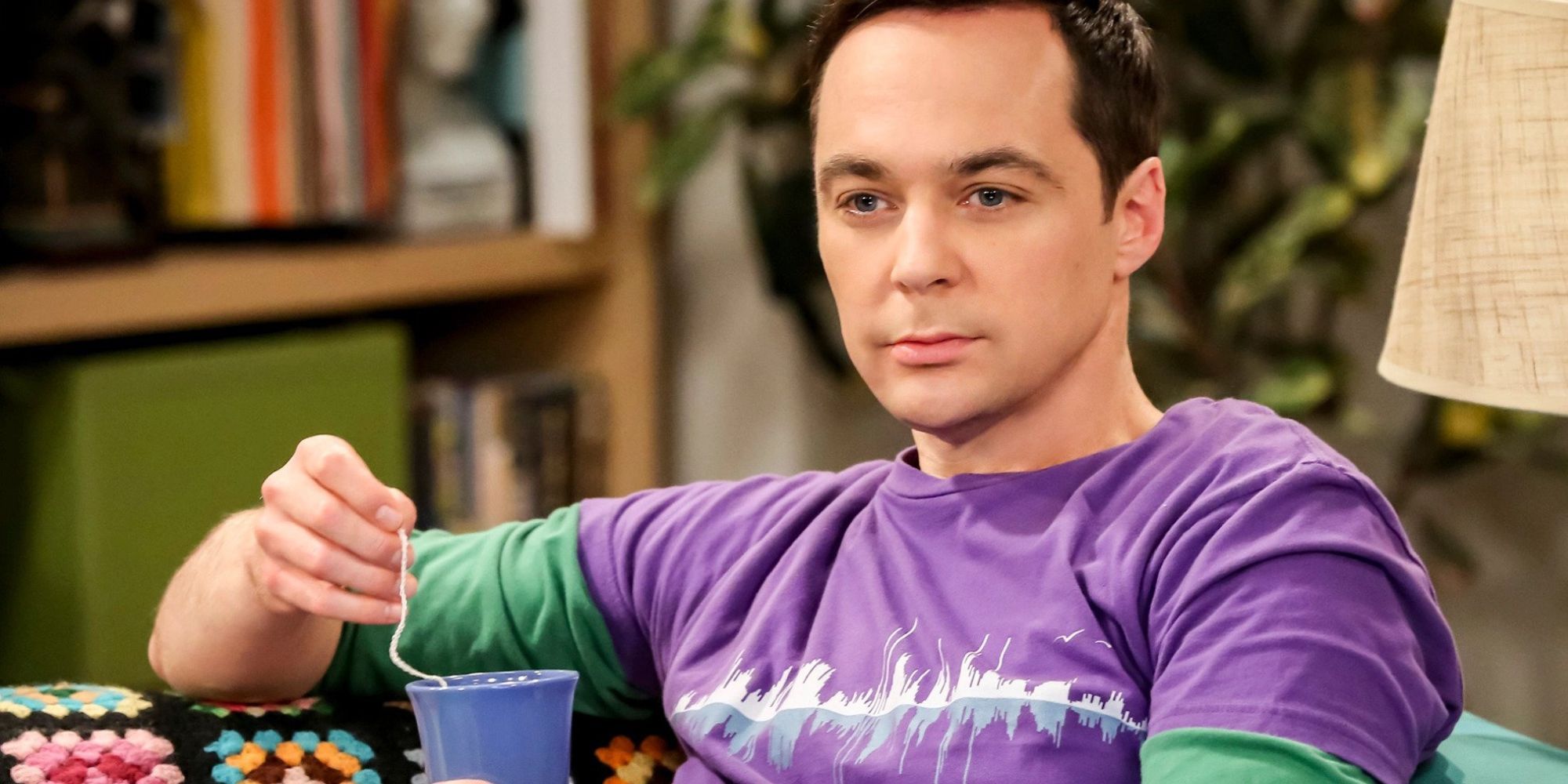 Jim Parsons as Sheldon Cooper drinking tea in The Big Bang Theory