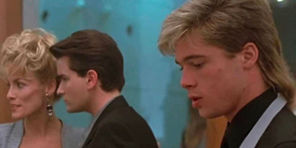 Brad Pitt appears as a young Waiter while notorious car thief Ted Varrick (Charlie Sheen) converses with people in the background.