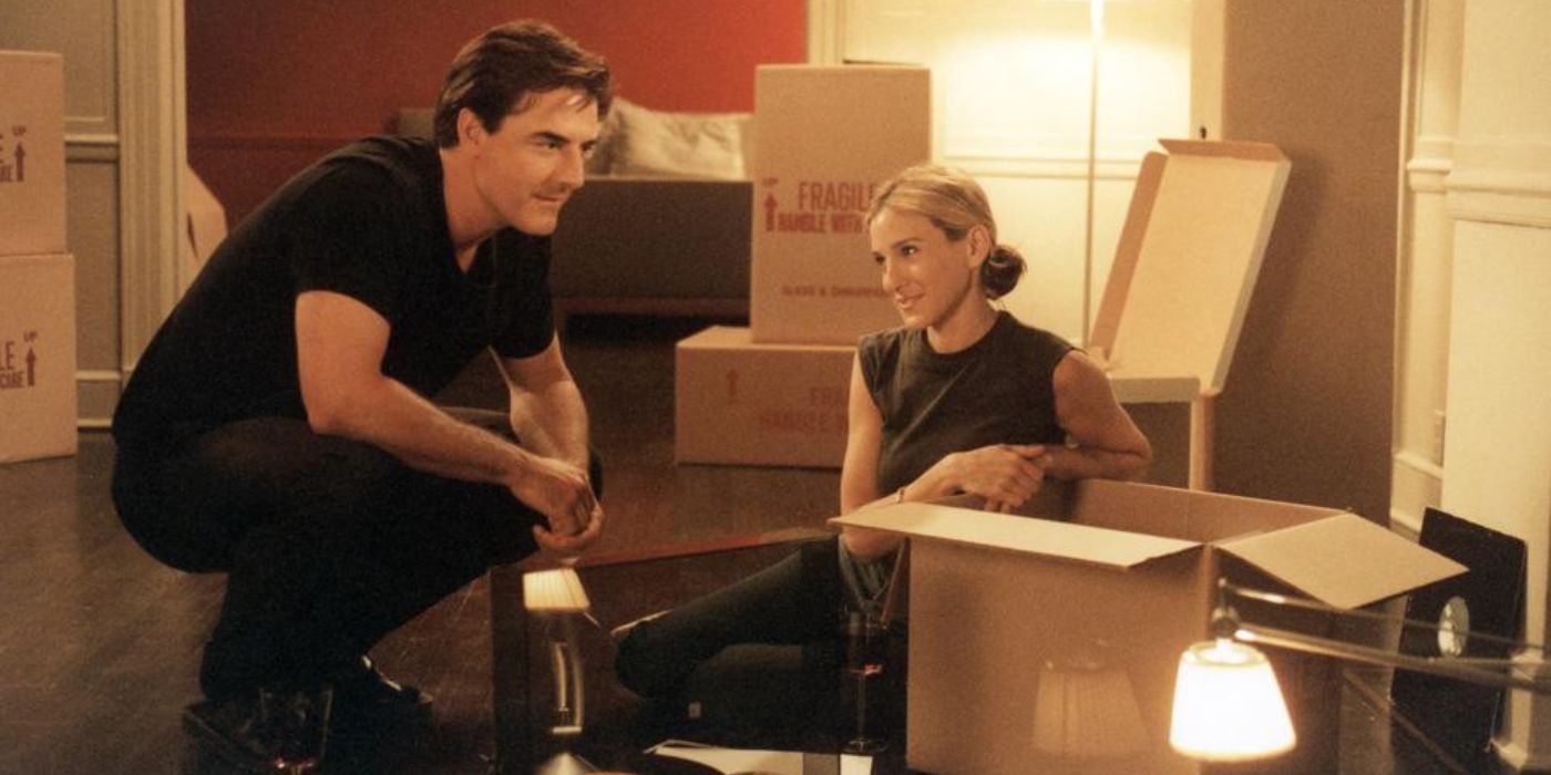 Big and Carrie in an empty apartment full of boxes in Sex and the City