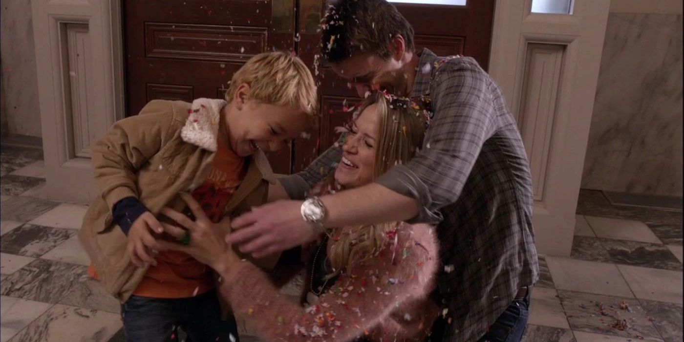 Clay (Robert Buckley), Quinn (Shantel VanSanten), Logan (Pierce Gagnon) laughing and hugging in One Tree Hill