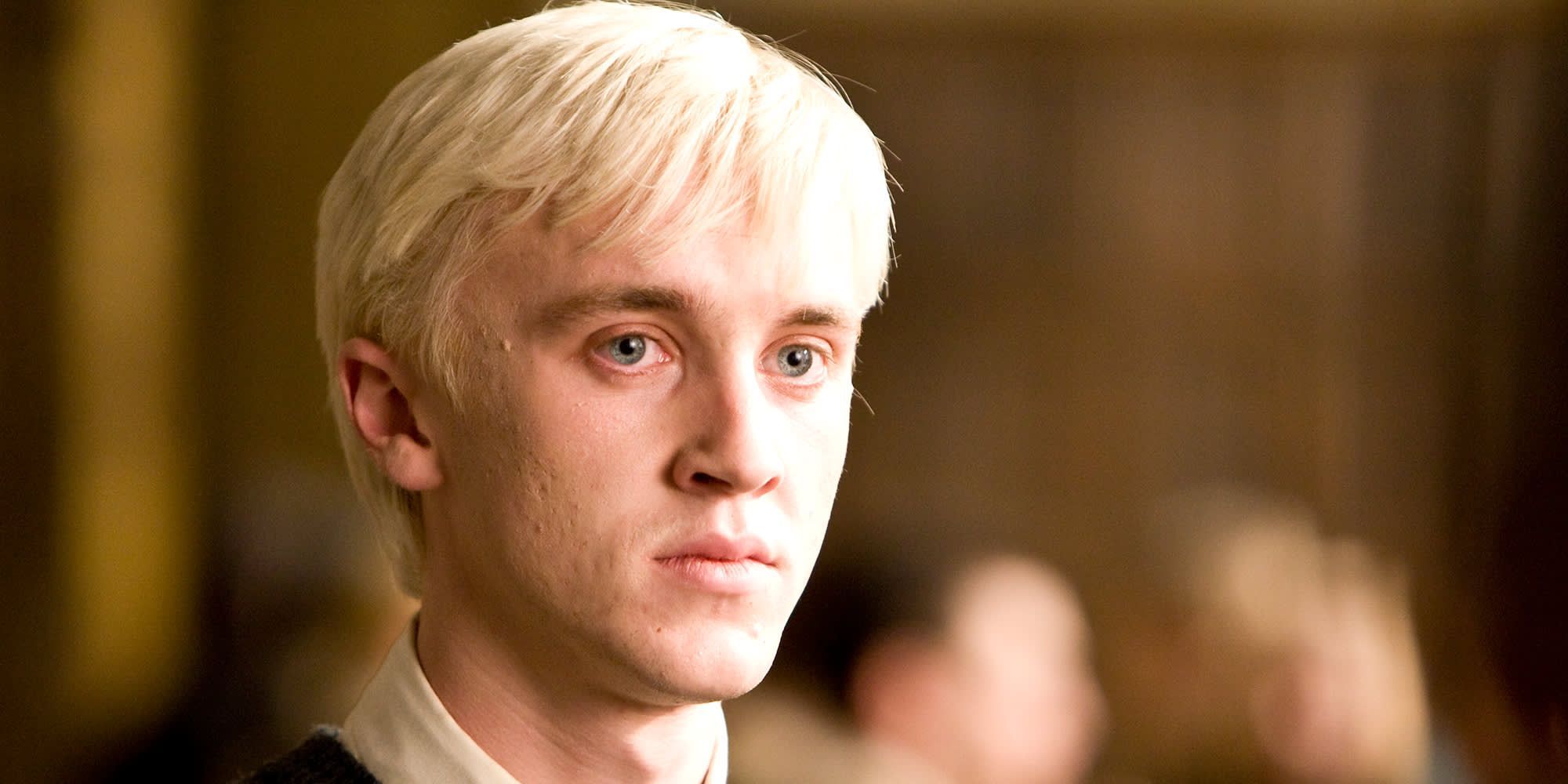 Tom Felton as Draco Malfoy looking serious in Harry Potter.