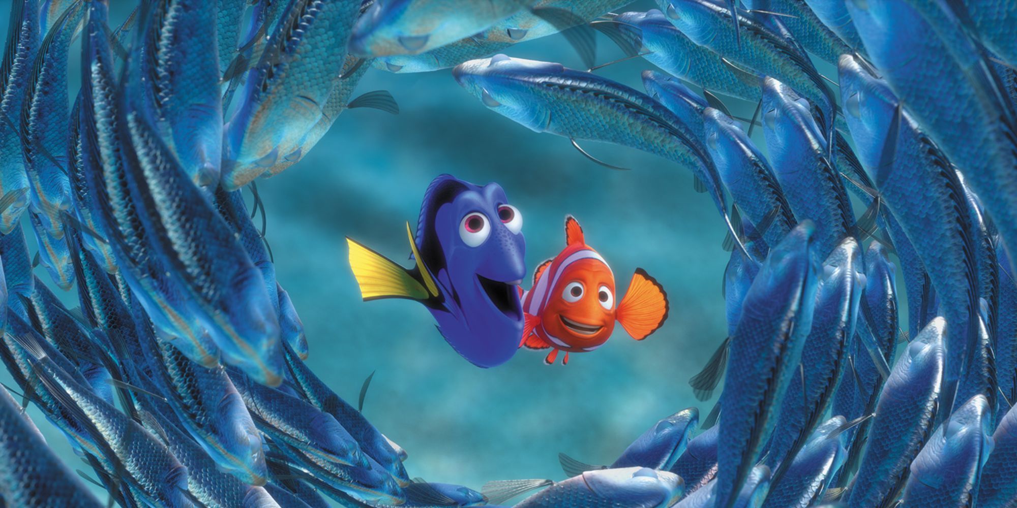 Dory and Marlin smiling as they swim through a circle of fish in Finding Nemo
