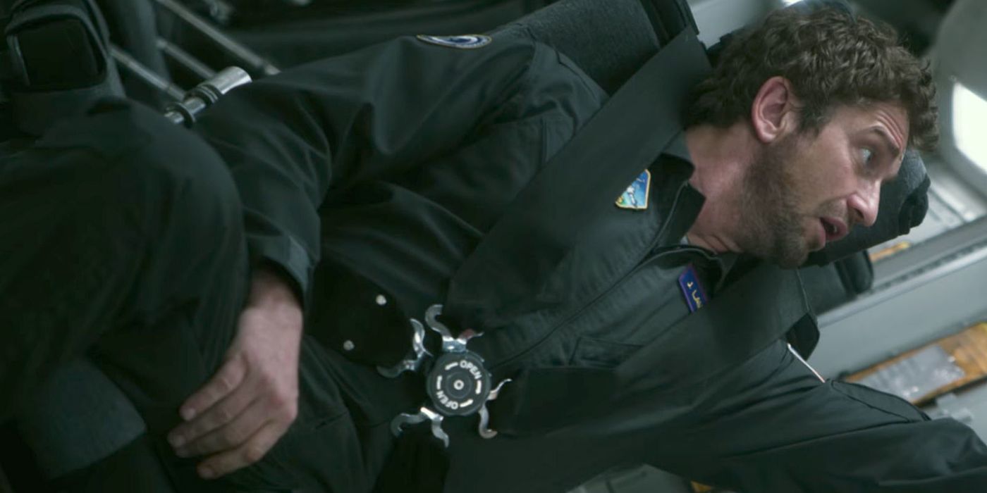 Gerard Butler is strapped into a space ship in Geostorm, where Butler plays Jake Lawson