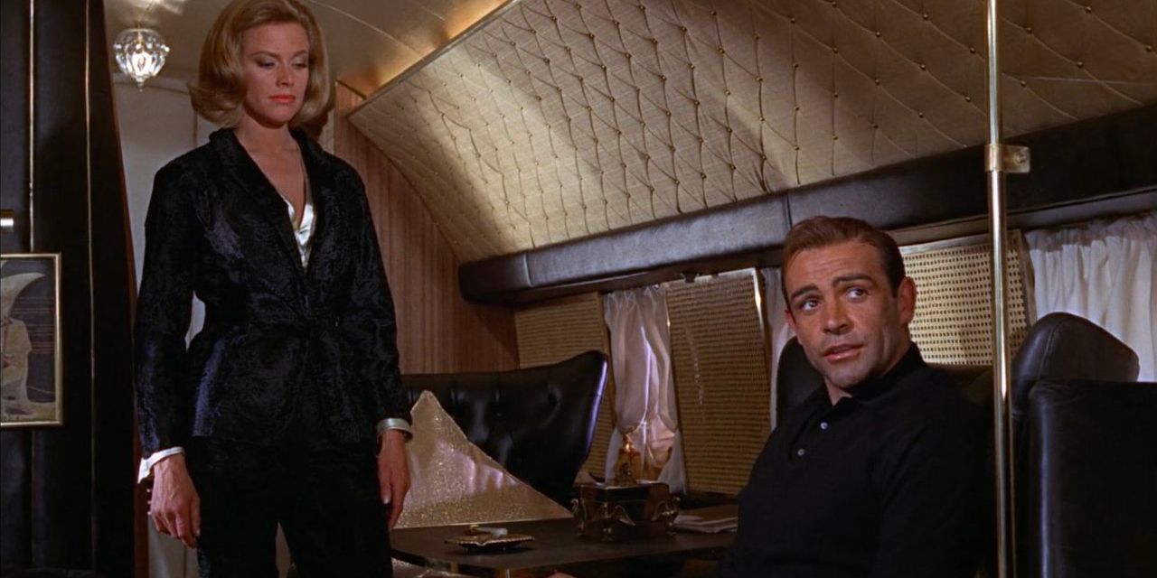 James Bond (Sean Connery) orders his famous Martini at the behest of Pussy Galore (Honor Blackman).