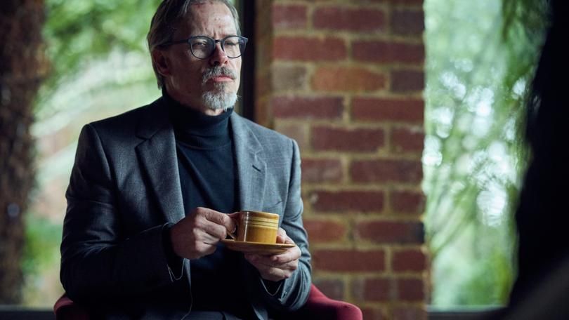 guy pearce as dr. bryce in the clearing drinking tea