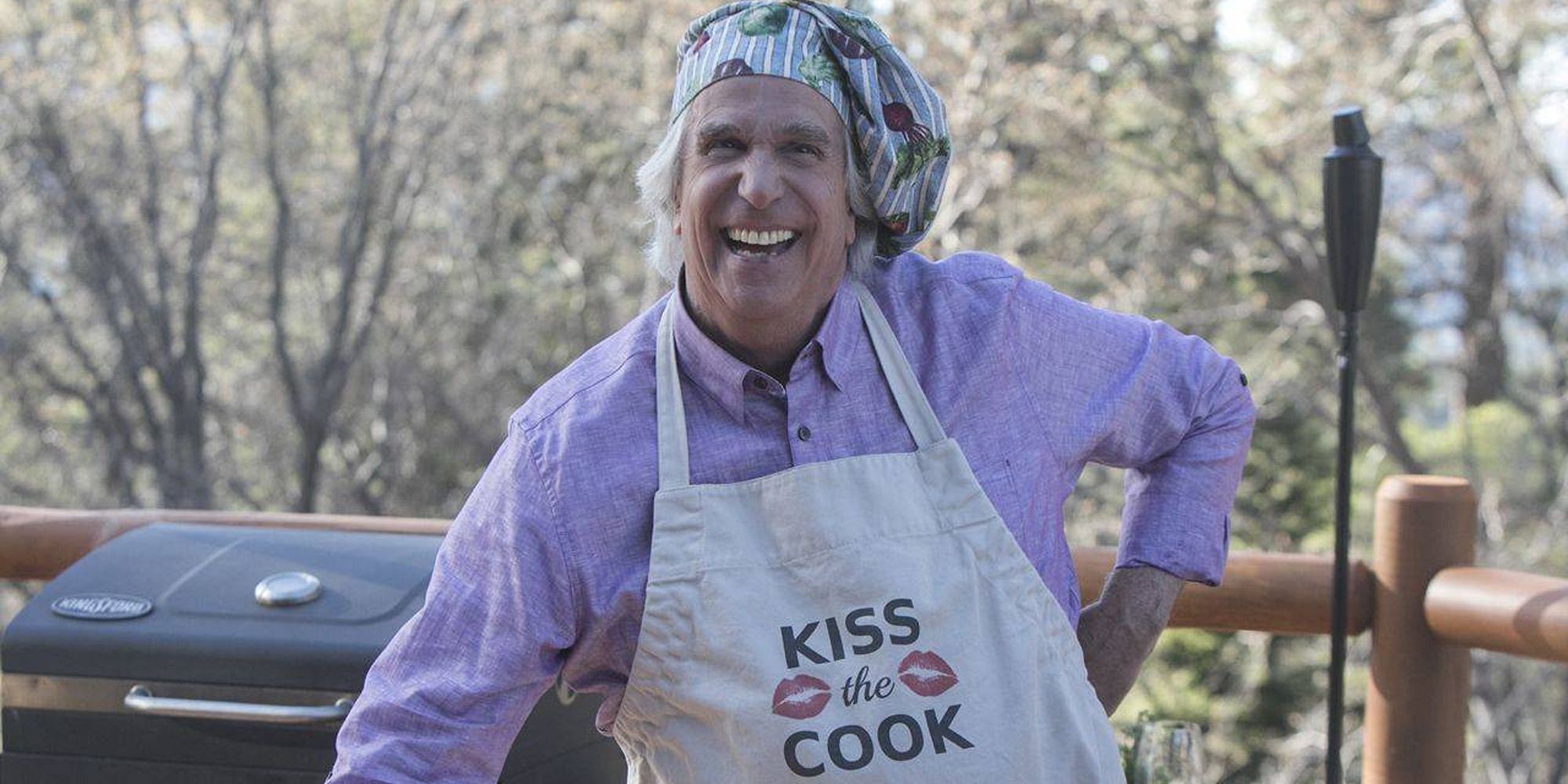 Henry Winkler as Gene Cousineau 'Barry' Season 1, with a cooking hat and apron in front of a grill