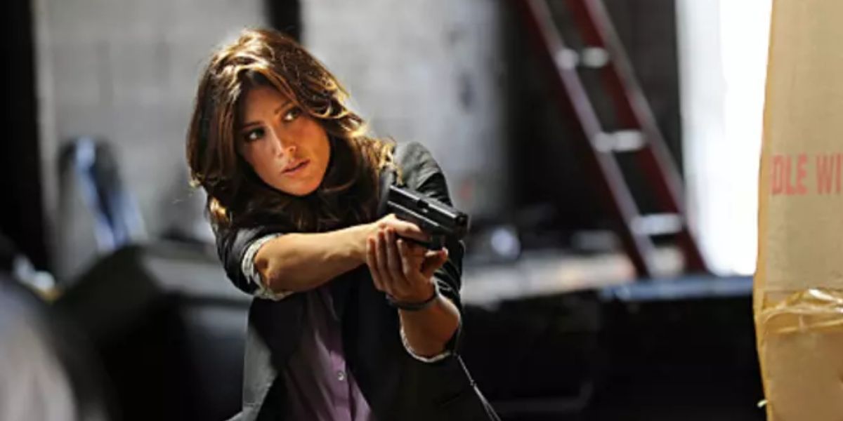 Jackie (Jennifer Esposito) holding a gun on 'Blue Bloods.'