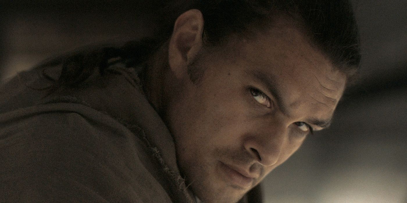 A close-up of Jason Momoa looking off to the side, squinting his eyes in anger in a scene from Dune.