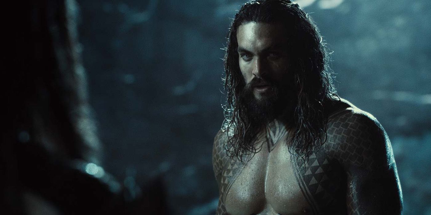 Jason Momoa looking menacing and shirtless in a scene from Zack Snyder's Justice League.