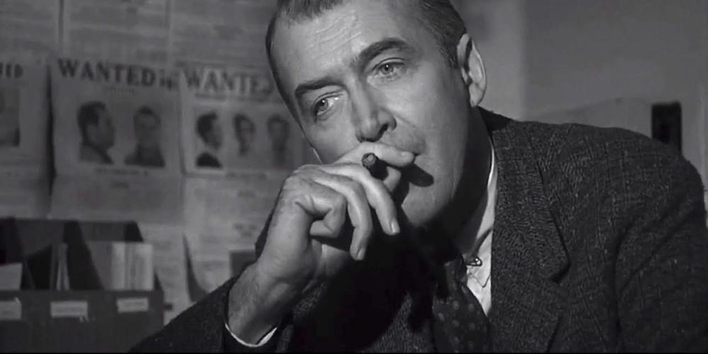 Jimmy Stewart smoking a cigar and staring in Anatomy of a Murder
