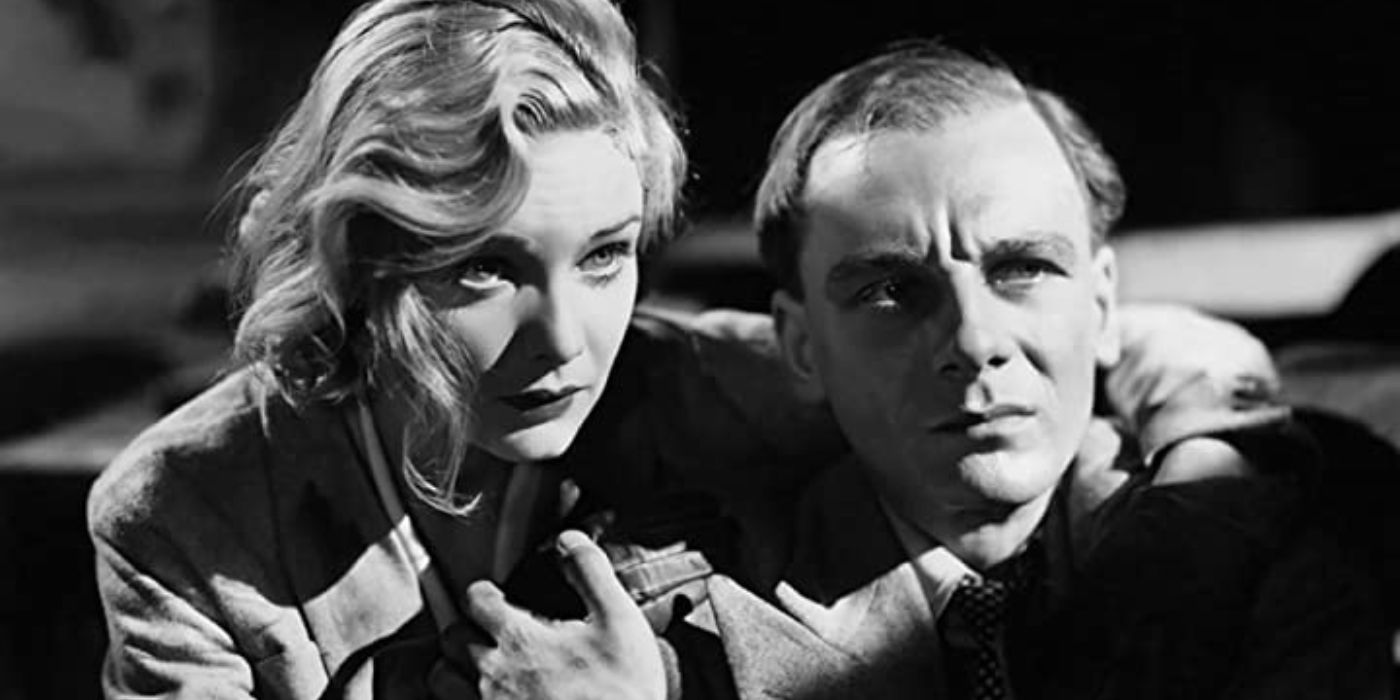 John Gielgud and Madeline Caroll holding each other in Secret Agent