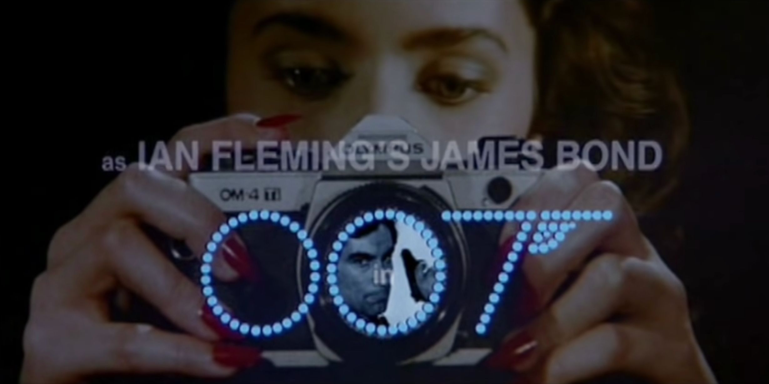 A girl uses a camera in the opening credits sequence to 'Licence to Kill'.