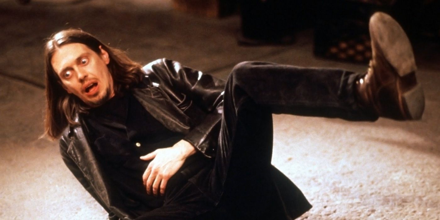 Steve Buscemi dans le rôle de Nick Reve allongé sur le sol, l'air choqué dans Living in Oblivion