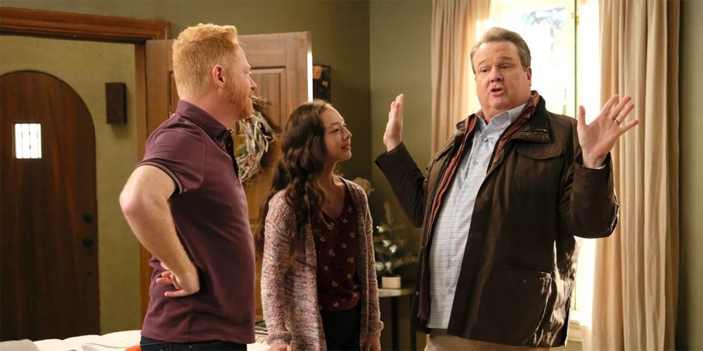 Mitchell (Jesse Tyler Ferguson), Cameron (Eric Stonestreet), and Lily (Aubrey Anderson-Emmons) in Modern Family