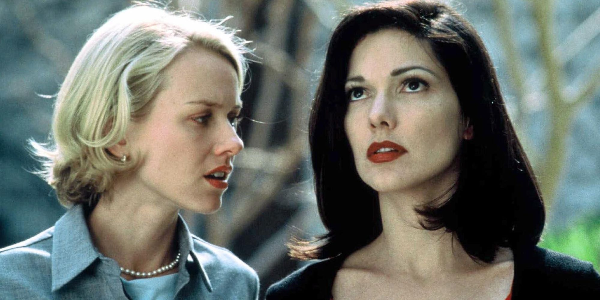 Two of the main characters stand outside and look tense in Mulholland Drive.