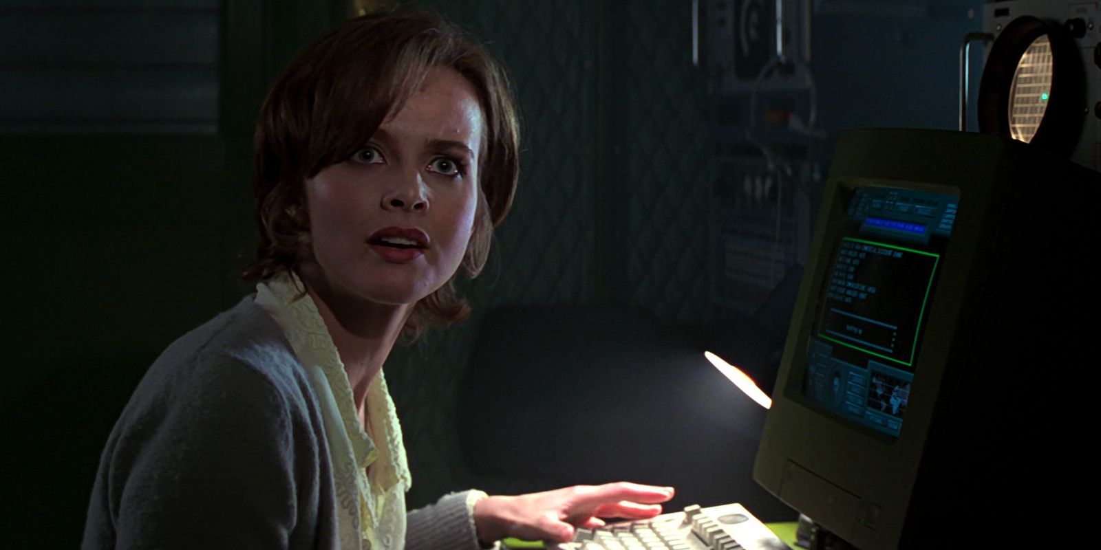 Natalya Simonova (Izabella Scorupco) works on a computer.